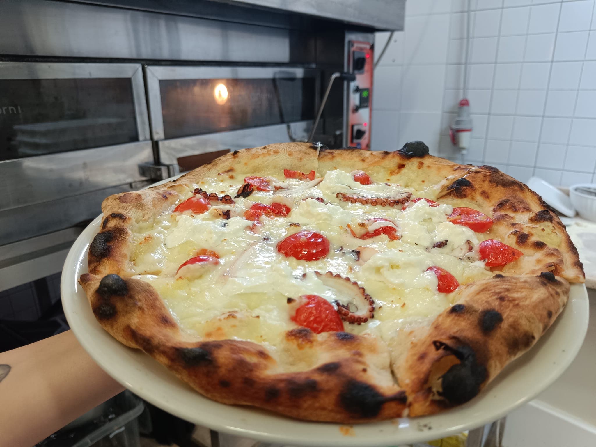 Crema di patate, Crema di patate, pomodorini gialli, carpaccio di polpo, mozzarella e stracciatella.